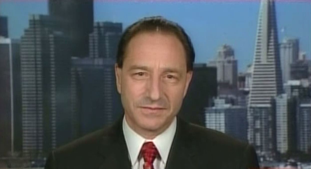 Photo of Daniel Horowitz on television show with background of city